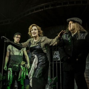 Bobby Strong (Matthew Seadon-Young), Penelope Pennywise (Jenna Russell), Old Man Strong (Cory English) in Urinetown The Musical, photo Johan Persson 